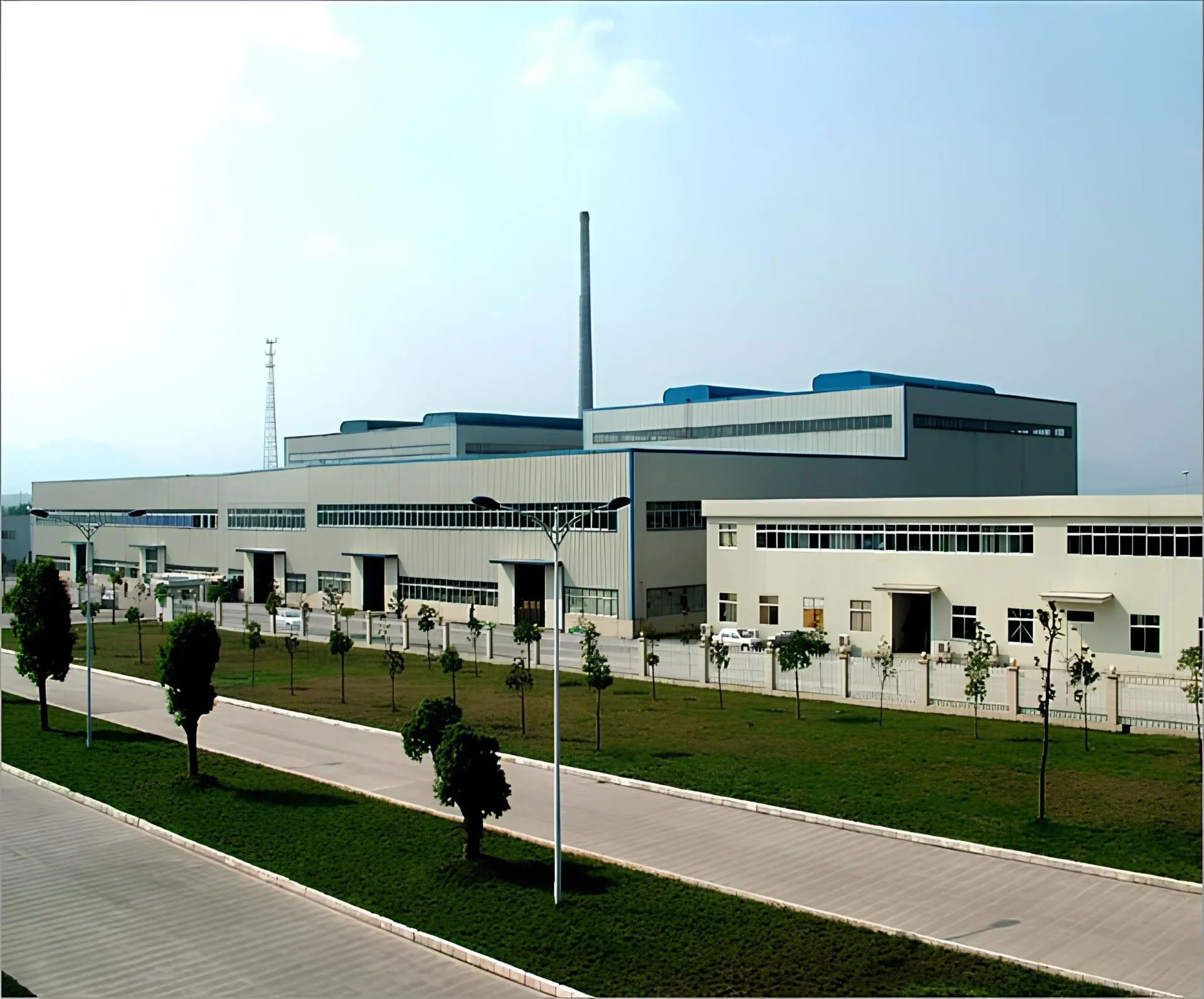 Modern factory producing cosmetic glass bottles with automated machinery and bright clean environment at QM Cos Pack.